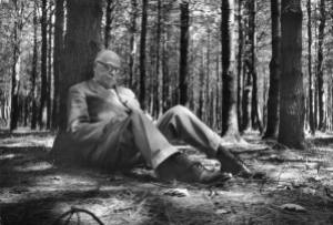 Thornton Wilder writing in the woods